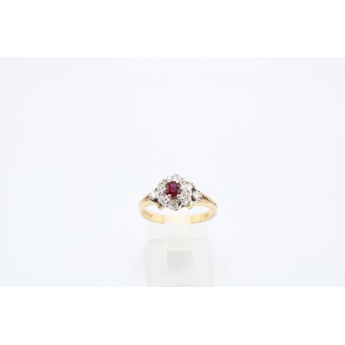  An 18ct Ruby & Diamond Cluster Ring Featuring a pierced shoulder design with ascent stones and c... 