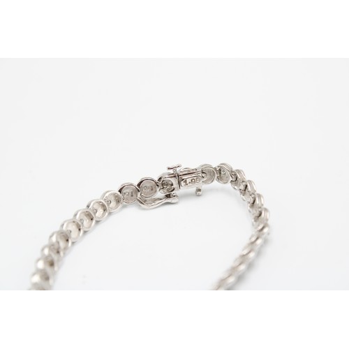  A 9ct White Gold Diamond Line Bracelet with Illusion Set Circular Settings&nbsp;Weight: 11g Length: ... 