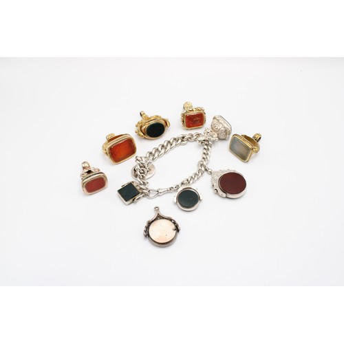  A collection of eleven hardstone fob seals, late 19th and early 20th centuries, bloodstone, carnelia... 
