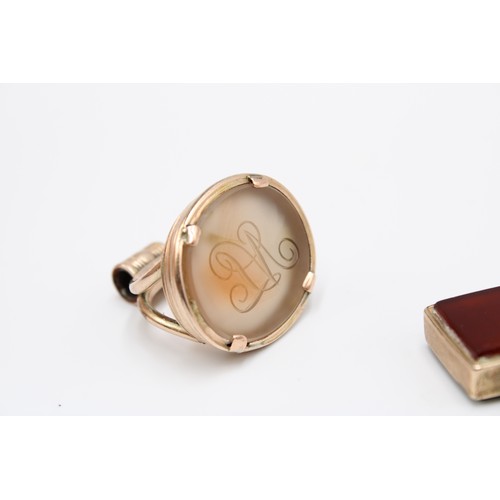  Three 9ct gold-mounted fob seals, late 19th and early 20th centuries, the first a bloodstone and car... 