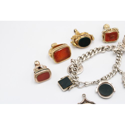 A collection of eleven hardstone fob seals, late 19th and early 20th centuries, bloodstone, carnelia... 