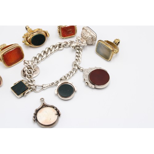  A collection of eleven hardstone fob seals, late 19th and early 20th centuries, bloodstone, carnelia... 