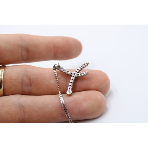  A 9ct White Gold Broken Necklace, Flat Curb Link Design with central diamond cross over pendant, Set... 