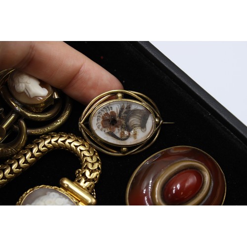  An interesting collection of jewellery, late 18th century and later, including 24 brooches, some Etr... 