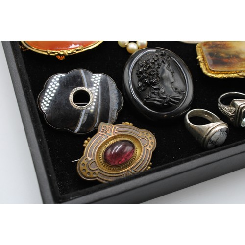  An interesting collection of jewellery, late 18th century and later, including 24 brooches, some Etr... 