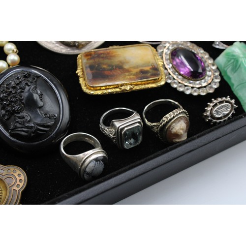  An interesting collection of jewellery, late 18th century and later, including 24 brooches, some Etr... 