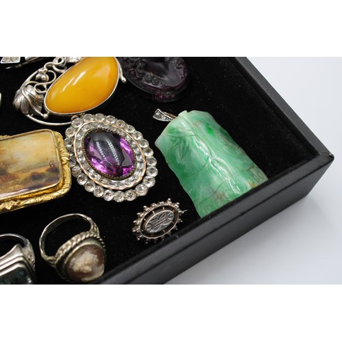  An interesting collection of jewellery, late 18th century and later, including 24 brooches, some Etr... 