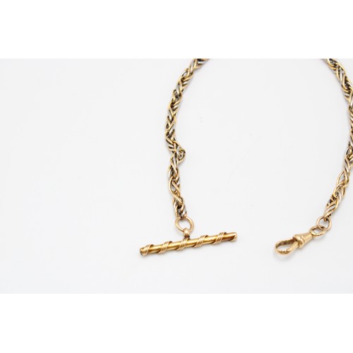  An 18ct gold tested fancy Albert watch chain, probably French, the links of white and yellow gold, w... 