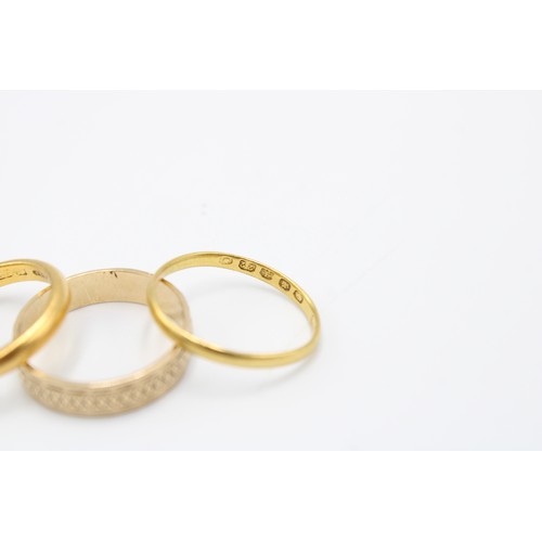  A Group of Rings to include Two 22ct Bands, and One 9ct Band with Diamond Cut Styling&nbsp;22ct: 5.8... 