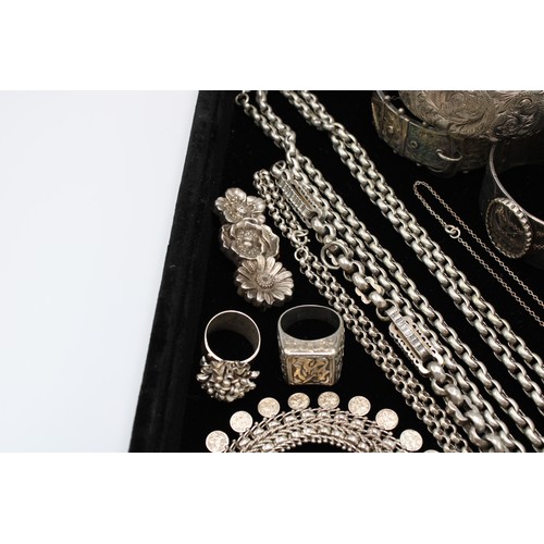  A group of silver jewellery, comprising six brooches, two set with hardstones and semi-precious gems... 