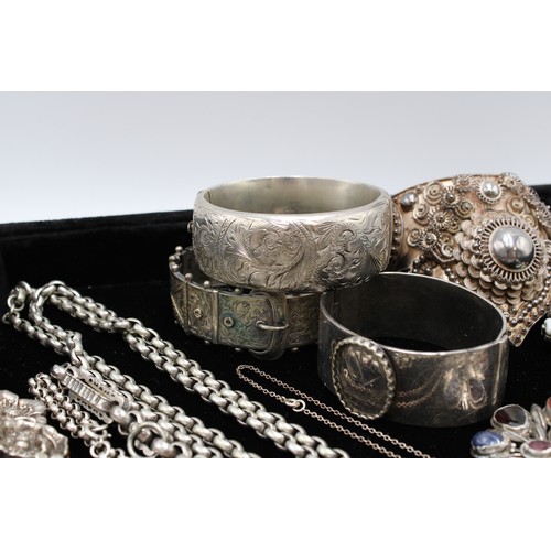  A group of silver jewellery, comprising six brooches, two set with hardstones and semi-precious gems... 