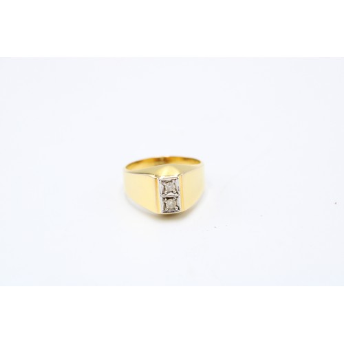  A brilliant cut diamond two stone signet ring. Size P 1/2. Stamped 14K. Weight 5.76 grams