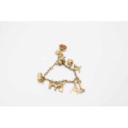 38 - A 9ct Charm Bracelet Comprising of 9 charms to include Fob Seal, Keys and others&nbsp;Gross Weight: ... 