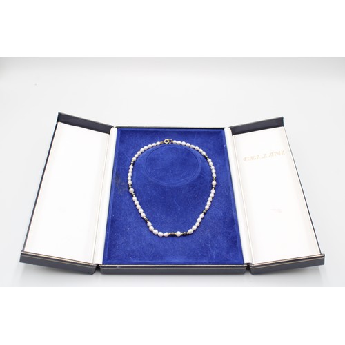 35 - A Cellini Freshwater Pearl Necklace approx. 38cms Long, Interspaced with 18ct Yellow Gold Beads with... 