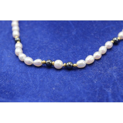 35 - A Cellini Freshwater Pearl Necklace approx. 38cms Long, Interspaced with 18ct Yellow Gold Beads with... 