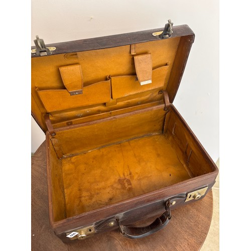 444 - A leather suitcase, second quarter 20th century, brass fittings, width 54cm