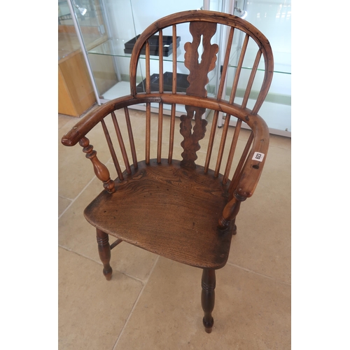 623 - A 19th century yew Windsor armchair needing restoration