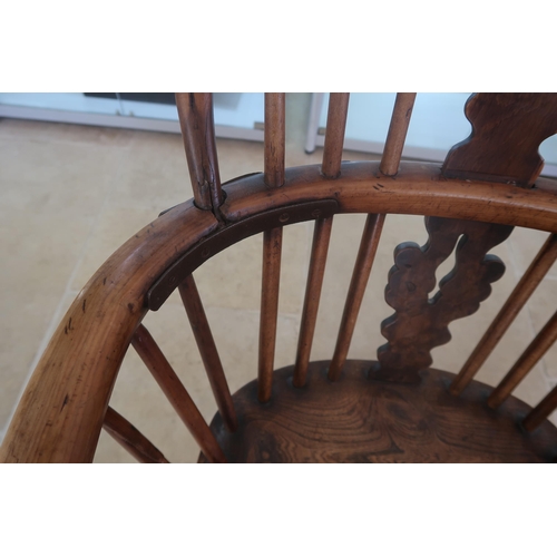623 - A 19th century yew Windsor armchair needing restoration