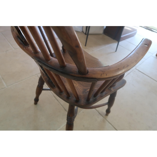 623 - A 19th century yew Windsor armchair needing restoration