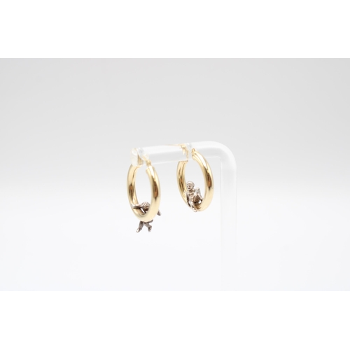 22 - A Pair of 14ct & Platinum Hoops with Seated Cherub Design, 2cm Across.&nbsp;Weight: 3g&nbsp;... 