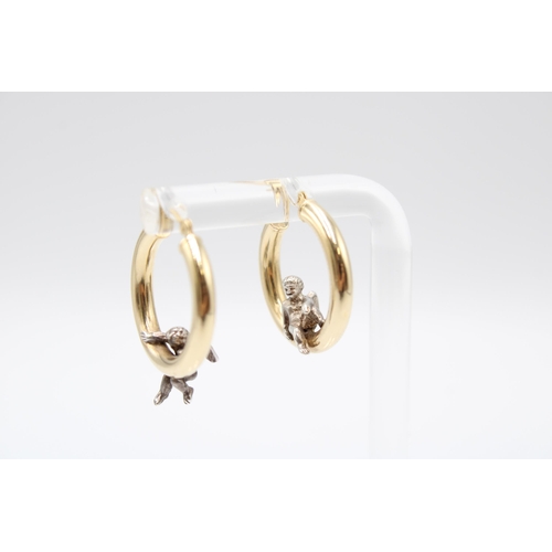 22 - A Pair of 14ct & Platinum Hoops with Seated Cherub Design, 2cm Across.&nbsp;Weight: 3g&nbsp;... 