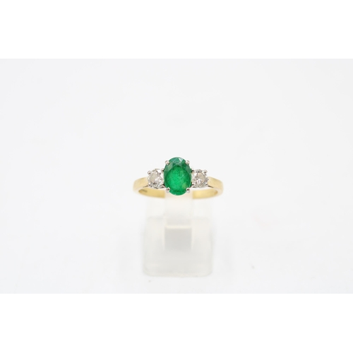 5 - An 18ct gold emerald and diamond three stone ring. Emerald estimated 1.08ct. Diamonds estimated tota... 