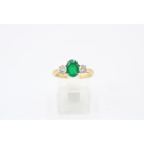 5 - An 18ct gold emerald and diamond three stone ring. Emerald estimated 1.08ct. Diamonds estimated tota... 