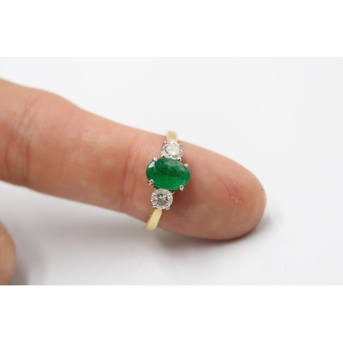 5 - An 18ct gold emerald and diamond three stone ring. Emerald estimated 1.08ct. Diamonds estimated tota... 
