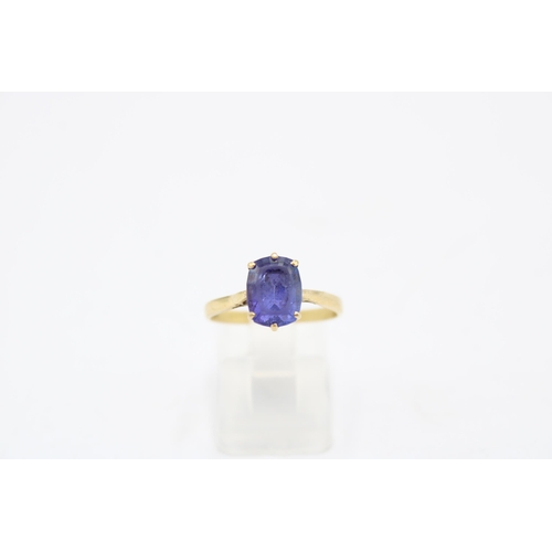 8 - An 18ct gold tanzanite single stone ring. Size P. Weight 2.98 grams