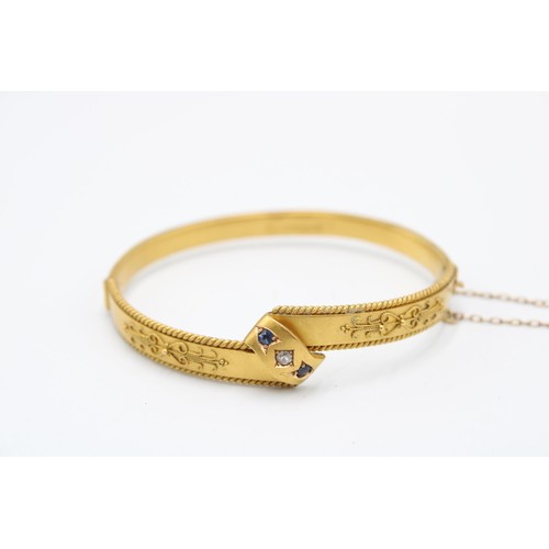 3 - An 15ct 1886 Dated Victorian Diamond & Sapphire Hinged Bangle. Featuring a rope twist border wit... 