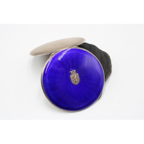 349 - A 1934 Dated Sterling Silver Circular Powder Company, Featuring a blue guilloche enamel body with en... 