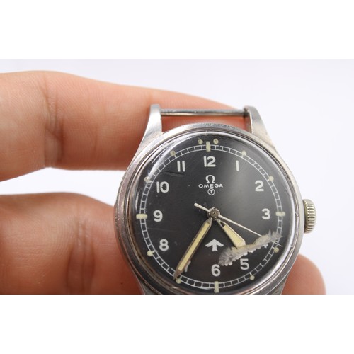  A Military Issue Omega, 6B/542, Issued 1953. The black dial with Arabic numerals, white outer minute... 