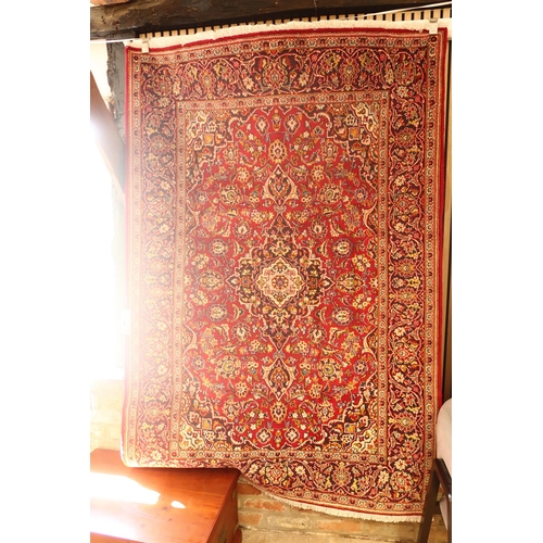 606 - A handmade woollen Kashan rug - 2.02m x 1.41m