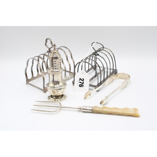  A group of silver objects, comprising two toast racks, the first I. S. Greenberg & Co., Birmingh... 