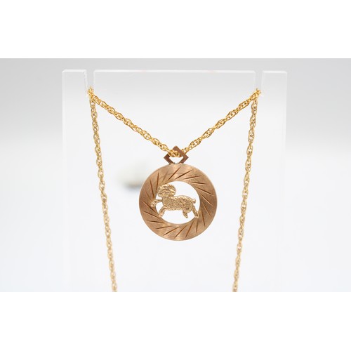  A 9ct gold Ram pendant and chain. Base metal clasp. Weight 6.91 grams