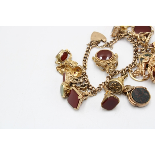 10 - A 9ct Tested Vintage Charm Bracelet, Comprising of 17 Charms mostly Stone Set. Gross Weight: 75g (To... 