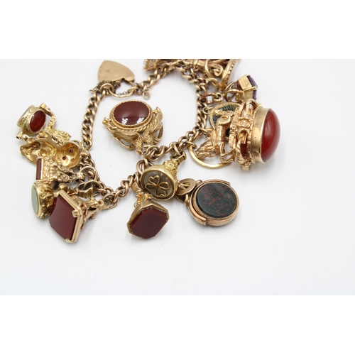 10 - A 9ct Tested Vintage Charm Bracelet, Comprising of 17 Charms mostly Stone Set. Gross Weight: 75g (To... 
