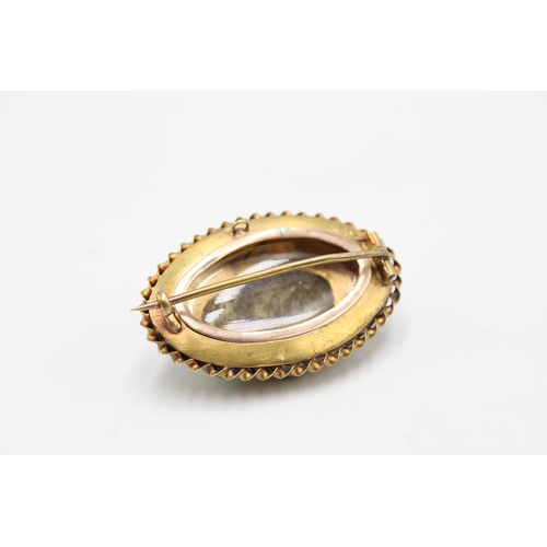  A late 19th/ early 20th century turquoise and diamond brooch with reverse photo panel. Length 35mm. ... 
