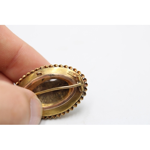  A late 19th/ early 20th century turquoise and diamond brooch with reverse photo panel. Length 35mm. ... 