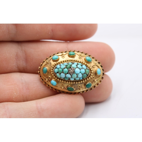  A late 19th/ early 20th century turquoise and diamond brooch with reverse photo panel. Length 35mm. ... 