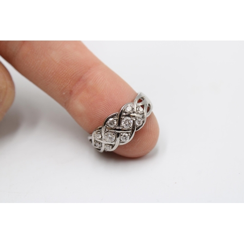  A 9ct gold brilliant cut diamond set band ring. Size P. Weight 4.63 grams