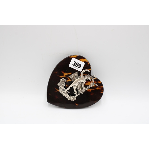 309 - A silver and tortoiseshell desk top paper clip, Samuel Jacob, London, 1895, cast and chased with Her... 