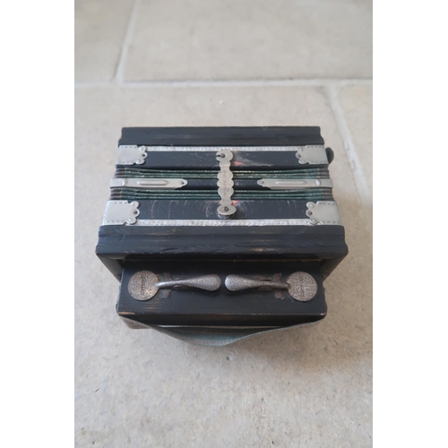 442 - A small eight button accordion, German, possibly Kalbe or Hohner, late 19th or early 20th century, e... 