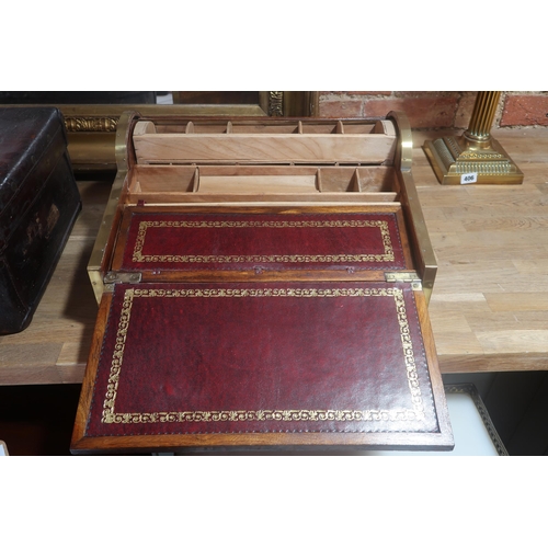 452 - A camphorwood and brass metamorphic writing slope, the roll top receding by opening the drawer, fitt... 