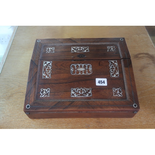 454 - A rosewood and mother of pearl writing slope, 19th century, the lid inlaid with foliate cartouches, ... 