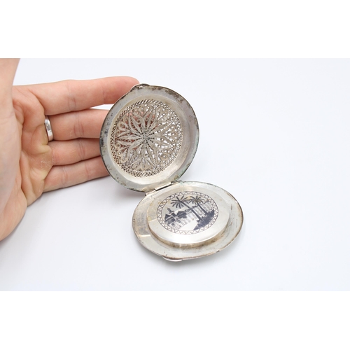 314 - An Iraqi Marsh Arab Silver Compact, Featuring a filagree Lid with Engraved Cartouche. To back, an en... 