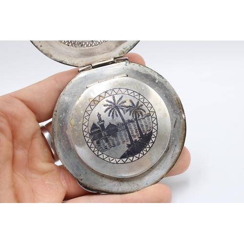 314 - An Iraqi Marsh Arab Silver Compact, Featuring a filagree Lid with Engraved Cartouche. To back, an en... 