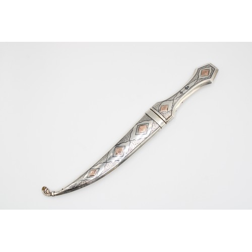 458 - A Late 19th, Early 20th Century Iraqi Marsh Arab Silver Dagger or Jambiya. Featuring a Curved Body w... 