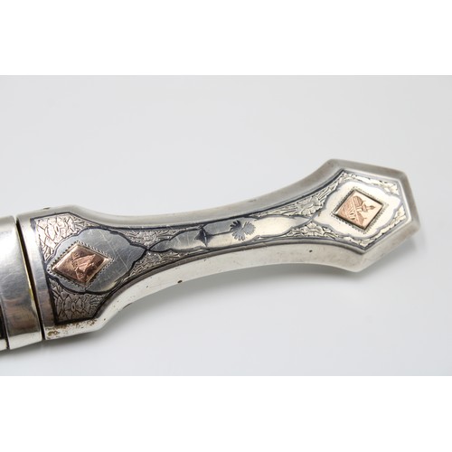 458 - A Late 19th, Early 20th Century Iraqi Marsh Arab Silver Dagger or Jambiya. Featuring a Curved Body w... 