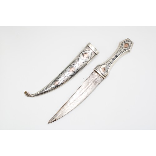 458 - A Late 19th, Early 20th Century Iraqi Marsh Arab Silver Dagger or Jambiya. Featuring a Curved Body w... 
